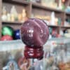 Quả cầu đá phong thủy đá mắt mèo màu tím